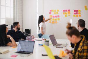 Small business team meeting - employee retention strategies USA 2026